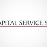 na szarym tle logotyp firmy Capital service S.A.